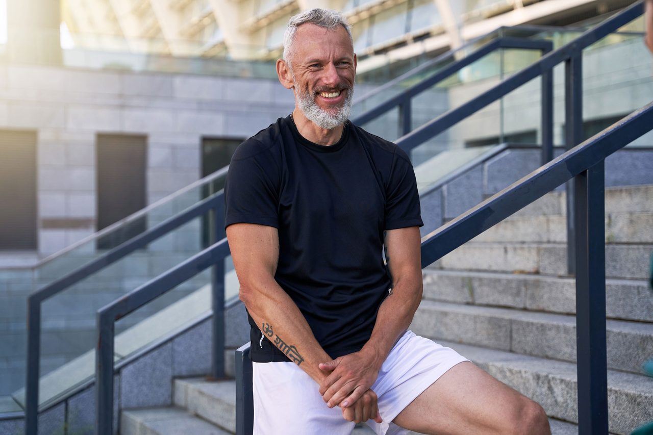 Man after exercising smiling