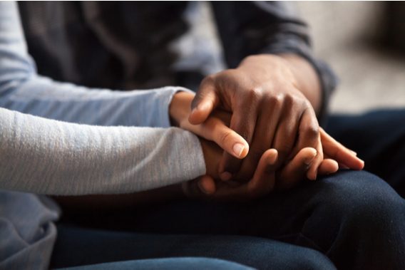 Couple holding hands